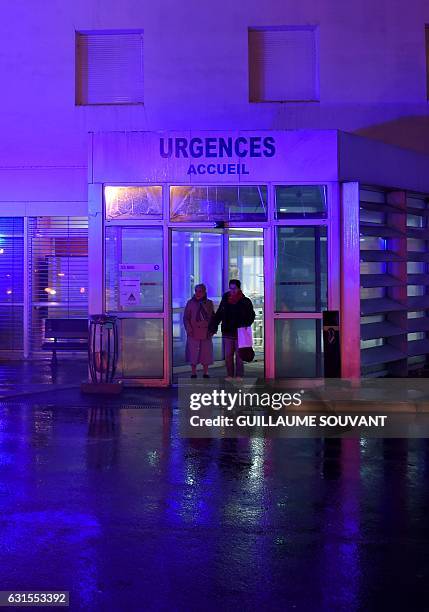 People wait at the entrance of the emergency department of the hospital of Trousseau in Tours on January 12, 2017. French hospitals are being...