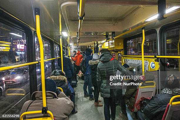 People in public bus are seen in Warsaw, capital of Poland on January 11th, 2017. The Polish capital offered free public transport to encourage...