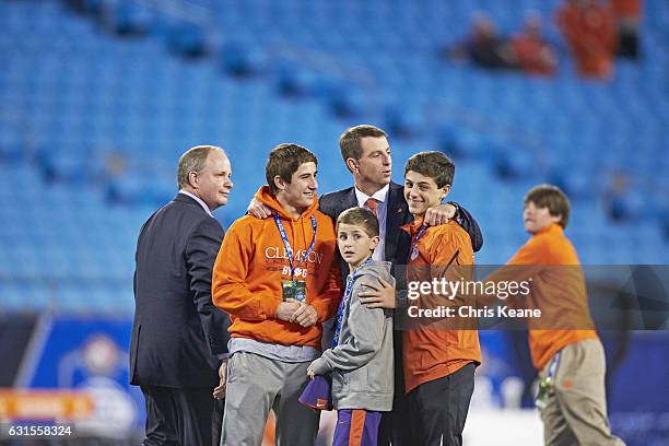Championship: Clemson head coach Dabo Swinney on field with his sons Drew, Will, and Clay before game vs North Carolina at Bank of America Stadium....