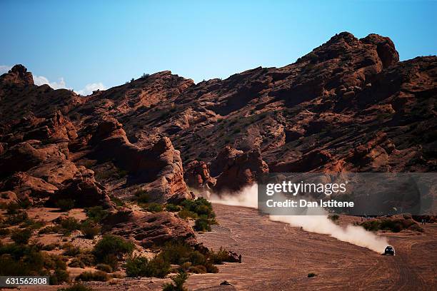 Yazeed Al Rajhi of Saudi Arabia and Mini X-Raid drives with co-driver Timo Gottschalk of Germany in the John Cooper Works Rally Mini car in the...