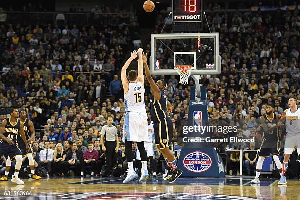 Nikola Jokic of the Denver Nuggets shoots against Kevin Seraphin of the Indiana Pacers as part of 2017 NBA London Global Games at the O2 Arena on...