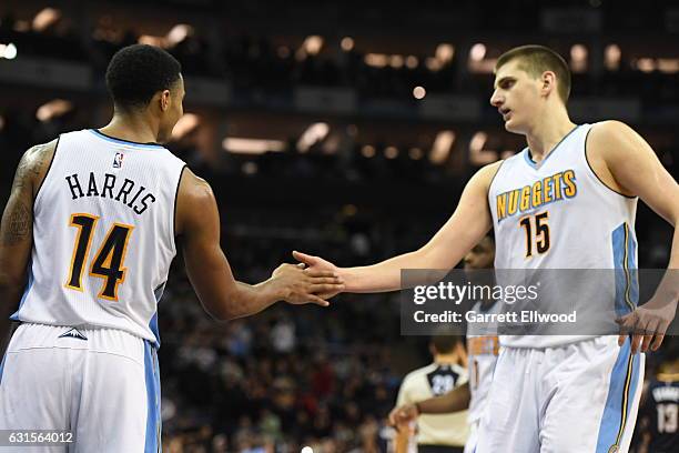 Nikola Jokic and Gary Harris of the Denver Nuggets high five each other against the Indiana Pacers as part of 2017 NBA London Global Games at the O2...