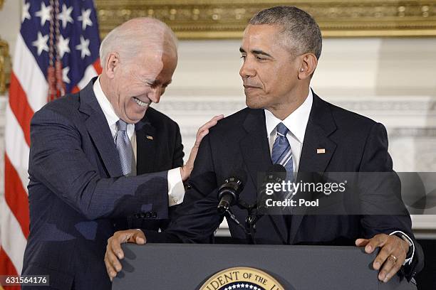 President Barack Obama delivers remarks at a tribute to Vice-President Joe Biden during an event in the State Dining room of the White House, January...