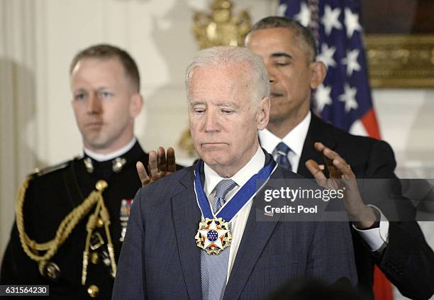 President Barack Obama presents the Medal of Freedom to Vice-President Joe Biden during an event in the State Dining room of the White House, January...