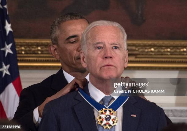 President Barack Obama awards Vice President Joe Biden the Presidential Medal of Freedom during a tribute to Biden at the White House in Washington,...