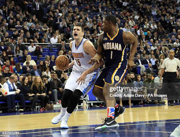 Denver Nuggets Nikola Jokic and Indiana Pacers Kevin Seraphin during the NBA Global game at the O2 Arena, London.