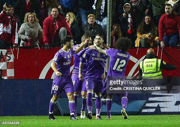 Real Madrid's defender Sergio Ramos ceebrates with teammate after scoring a goal during the Spanish Copa del Rey round of 16 second leg football...