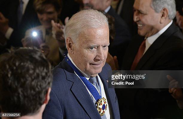 Vice-President Joe Biden leaves the the State Dining room of the White House after he received from President Obama the Medal of Freedom January 12,...