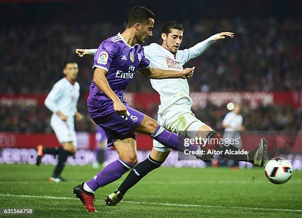 Lucas Vazquez of Real Madrid CF being followed by Sergio Escudero of Sevilla FC during the Copa del Rey Round of 16 Second Leg match between Sevilla...