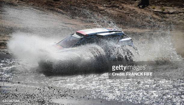 Peugeot's driver Cyril Despres and co-driver David Castera of France compete in Stage 10 of the 2017 Dakar Rally between Chilecito and San Juan,...