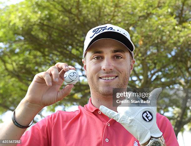 Justin Thomas of the United States celebrates after scoring a 59 during the first round of the Sony Open in Honolulu, Hawaii at Waialae Country Club...