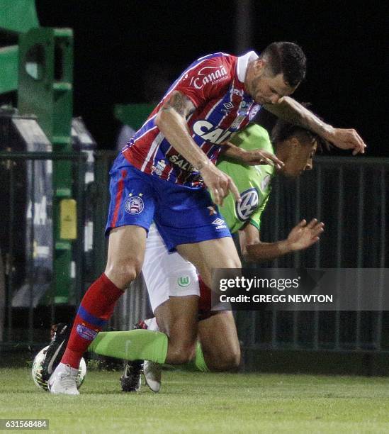 Tiago of Brazilian club EC Bahia strips the ball from Orrin McKinze Gaines II of German club VFL Wolfsburg during their Florida Cup soccer game at...