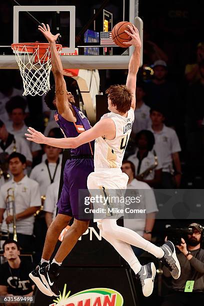 Ben Lammers of the Georgia Tech Yellow Jackets attempts a dunk against Jaron Blossomgame of the Clemson Tigers during the game at Hank McCamish...