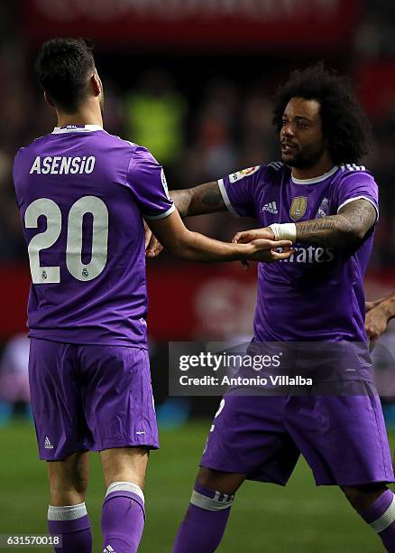 Marco Asensio of Real Madrid celebrates his goal whit Marcelo during the Copa del Rey round of 16 second leg match between Sevilla and Real Madrid CF...