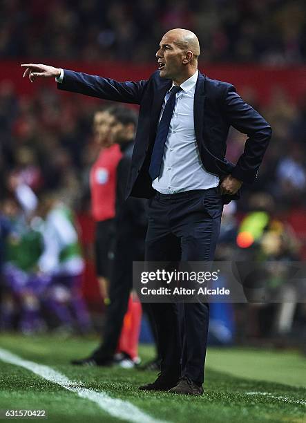 Head Coach of Real Madrid CF Zinedine Zidane gives instructions to his players during the Copa del Rey Round of 16 Second Leg match between Sevilla...