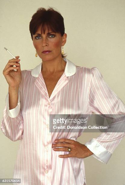 Actress Joanna Cassidy poses for a portrait session holding a cigarette in circa 1987 in Los Angeles, California.