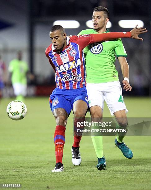 Forward Gustavo Souza of Brazilian club EC Bahia blocks forward Robin Ziegele of German club VFL Wolfsburg off the ball during their Florida Cup...