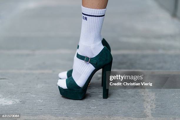 German fashion blogger and model Alexandra Lapp wearing white Mother Fucker knit socks with a vintage inspired, tube style and bold lettering by...