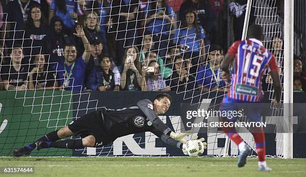 Goal keeper Alexander Brunst of German club VFL Wolfsburg blocks a kick by Antonio Aquino of Brazilian club EC Bahia during their Florida Cup soccer...