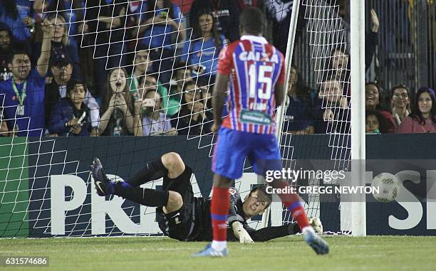 Goalkeeper Alexander Brunst of German club VFL Wolfsburg looks on after blocking a kick by Antonio Aquino of Brazilian club EC Bahia during their...