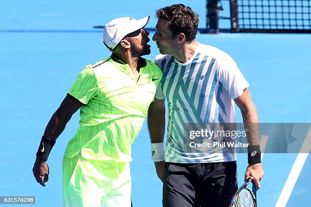 Nicholas Monroe of the USA speaks to his doubles partner Artem Sitak of New Zealand during their match against Jonathan Erlich and Scott Lipsky...