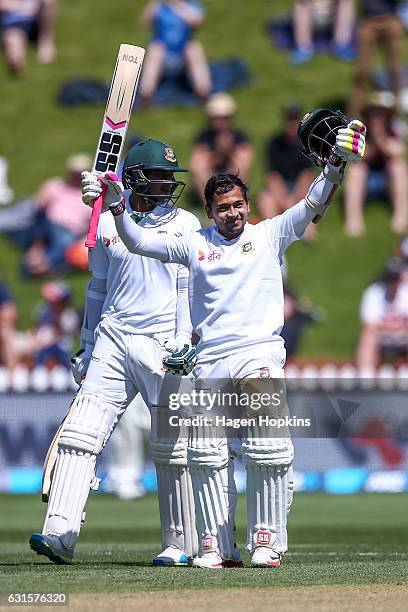 Mushfiqur Rahim of Bangladesh celebrates his century with teammate Shakib Al Hasan during day two of the First Test match between New Zealand and...