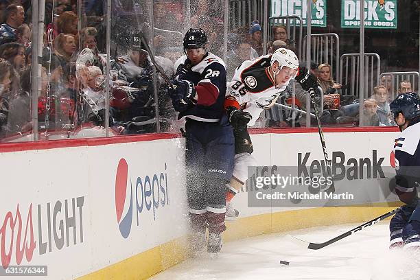 Patrick Wiercioch of the Colorado Avalanche collides with Ondrej Kase of the Anaheim Ducks at the Pepsi Center on January 12, 2017 in Denver,...