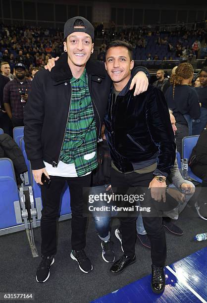 Mesut Ozil and Alexis Sanchez attend the Denver Nuggets v Indiana Pacers match as part of the NBA Global Games London 2017 at The O2 Arena on January...