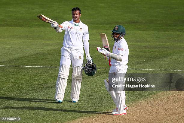 Shakib Al Hasan of Bangladesh celebrates his double century with teammate Mushfiqur Rahim during day two of the First Test match between New Zealand...