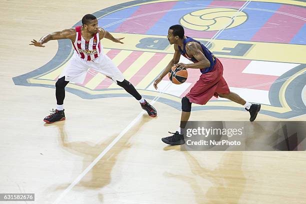 The FC Barcelona player Alex Renfroe from United States during defensed by The Olympiacos Piraeus Dominic Waters from United States the Euroleague...