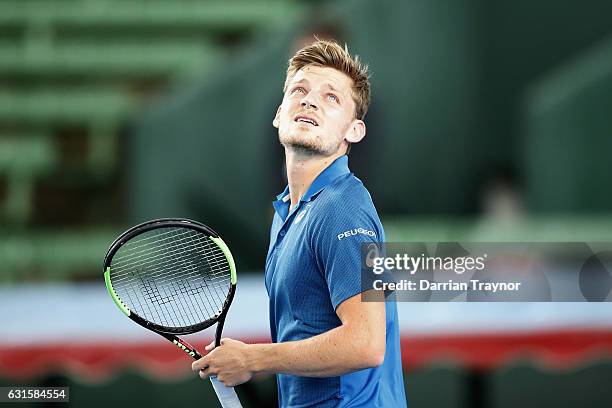 David Goffin of Belgium looks to the sky as dark rain clouds roll in during day four of the 2017 Priceline Pharmacy Classic at Kooyong on January 13,...