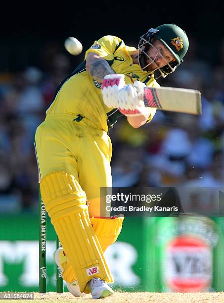 Matthew Wade of Australia hits the ball over the boundary for a six during game one of the One Day International series between Australia and...