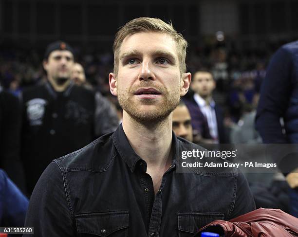 Arsenal's Per Mertesacker watches the game between Denver Nuggets and Indiana Pacers during the NBA Global game at the O2 Arena, London. PRESS...