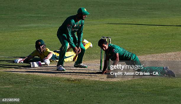 Australia's Matthew Wade dives to make a run during game one of the One Day International series between Australia and Pakistan at The Gabba on...