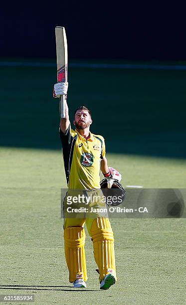 Australia's Matthew Wade celebrates his century during game one of the One Day International series between Australia and Pakistan at The Gabba on...
