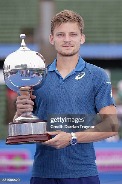 David Goffin of Belgium holds the trophy after winning the mens final against Ivo Karlovic of Croatia during day four of the 2017 Priceline Pharmacy...