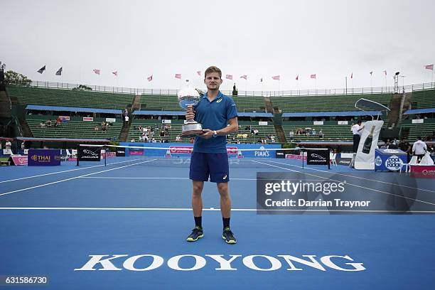 David Goffin of Belgium holds the trophy after winning the mens final against Ivo Karlovic of Croatia during day four of the 2017 Priceline Pharmacy...