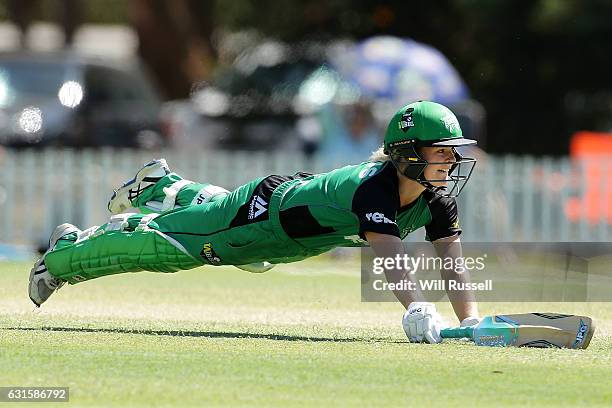 Katie Mack of the Stars dives for the crease during the Women's Big Bash League match between the Adelaide Strikers and the Melbourne Stars at Lilac...