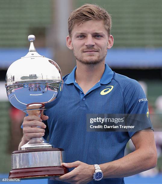 David Goffin of Belgium holds the trophy after winning the mens final against Ivo Karlovic of Croatia during day four of the 2017 Priceline Pharmacy...