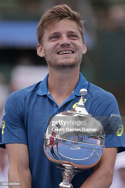 David Goffin of Belgium holds the trophy after winning the mens final against Ivo Karlovic of Croatia during day four of the 2017 Priceline Pharmacy...