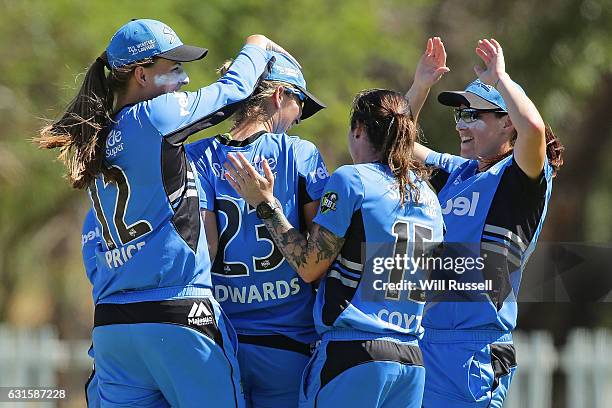 Alex Price of the Strikers celebrates after taking a catch off Jess Cameron of the Stars during the Women's Big Bash League match between the...