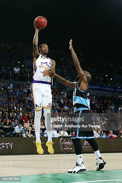 Greg Whittington of the Kings shoots over Kevin Dillard of the Breakers during the round 15 NBL match between the New Zealand Breakers and the Sydney...
