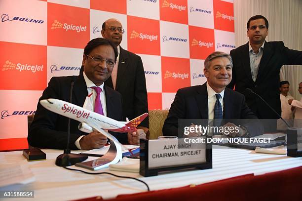 Spicejet Chairman Ajay Singh and Raymond L. Conner , Vice-Chairman of Boeing, attend a press conference in New Delhi on January 13, 2017. Indian...