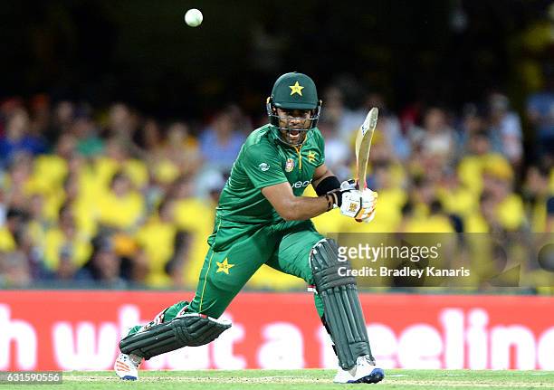 Umar Akmal of Pakistan plays a shot during game one of the One Day International series between Australia and Pakistan at The Gabba on January 13,...
