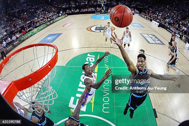 Paul Carter of the Breakers competes for a rebound against Greg Whittington of the Kings during the round 15 NBL match between the New Zealand...