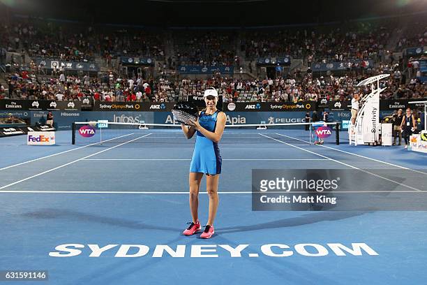 Johanna Konta of Great Britain poses with the winners trophy after the Womens Final match against Agnieszka Radwanska of Poland during the Sydney...