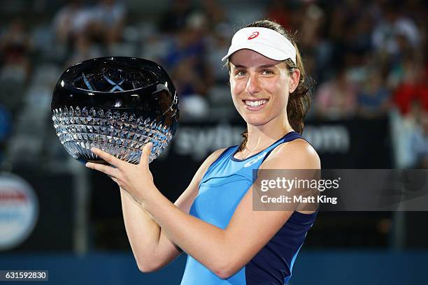 Johanna Konta of Great Britain poses with the winners trophy after the Womens Final match against Agnieszka Radwanska of Poland during the Sydney...