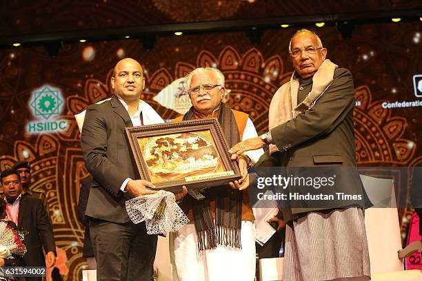 Commonwealth Games gold-medallist boxer Akhil Kumar with Haryana CM Manohar Lal Khattar and Governor of Haryana Kaptan Singh Solanki during the first...