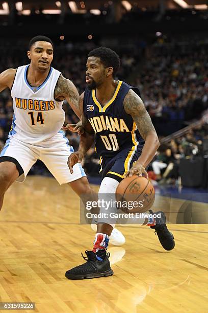 Aaron Brooks of the Indiana Pacers dribbles against Jameer Nelson of the Denver Nuggets as part of 2017 NBA London Global Games at the O2 Arena on...