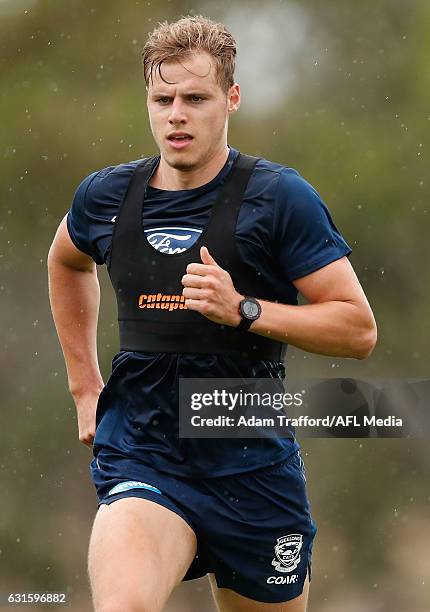 Jake Kolodjashnij of the Cats runs during the Geelong Cats training session at Deakin University, Waurn Ponds on January 13, 2017 in Geelong...